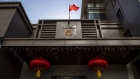 The Chinese flag stands on display outside the China Consulate General building in Houston, Texas, on July 22. Photographer: Scott Dalton/Bloomberg