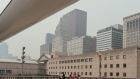 Buildings as smoke from Canada wildfires creates haze in Chicago, Illinois, US, on Tuesday, June 27, 2023. Smoke from wildfires burning in Canada are leading to very hazy conditions and prompting air quality alerts in the Chicago area Tuesday. Photographer: Jamie Kelter Davis/Bloomberg