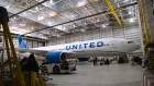 A Boeing 777-200 airplane in a United Airlines maintenance hangar at Newark Liberty International Airport (EWR) in Newark, New Jersey, US, on Tuesday, March 19, 2024. United Airlines Holdings Inc.'s shares rose after the carrier forecast better-than-expected profit this quarter, tempering concerns that Boeing Co. aircraft delays and regulatory pressure will put expansion plans at risk. Photographer: Angus Mordant/Bloomberg