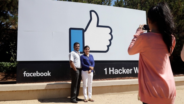 Facebook logo outside of the company's headquarters in Menlo Park , Calif.