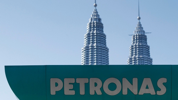 A Petronas gas station is pictured against Malaysia's landmark building, Petronas Twin Towers