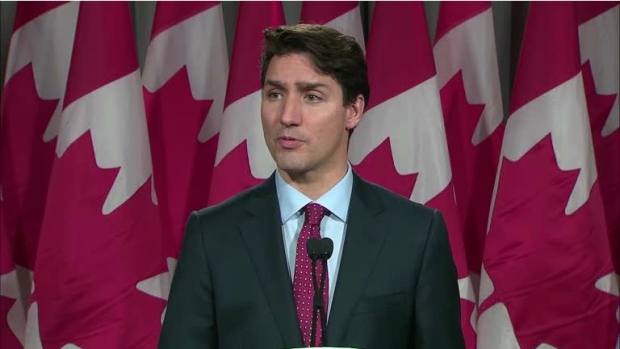 Prime Minister Justin Trudeau speaks to media following a summit meeting with investors in Toronto.