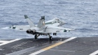 An F/A-18 Super Hornet takes off from the desk of the nuclear-powered USS George Washington 