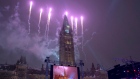 Fireworks behind the Peace Tower during on Parliament Hill Dec. 31, 2016. 