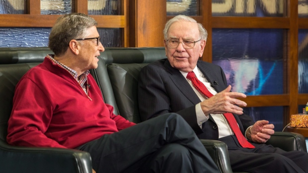 Bill Gates and Warren Buffett speak during an interview on the Fox Business Network, in Omaha