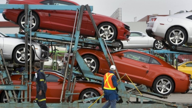 General Motors auto workers load the new Chevrolet Camaro for delivery, at the company's Oshawa Onta
