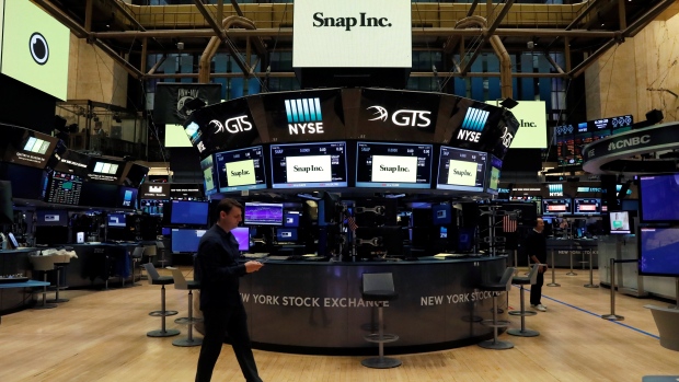 Snap Inc. logos are seen on the floor of the NYSE on the eve of the company's IPO in New York article image