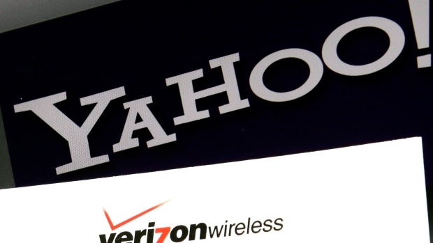 the Yahoo and Verizon logos on a laptop
