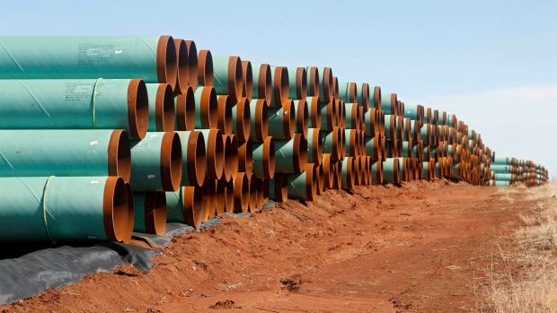 miles of pipe ready to become part of the Keystone Pipeline are stacked in a field near Ripley, Okla