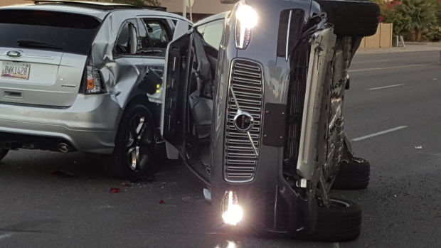 A self-driven Volvo SUV owned and operated by Uber Technologies Inc. flipped after collision. 