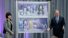 Governor of the Bank of Canada Stephen Poloz and Ginette Petitpas Taylor unveil a new $10 note