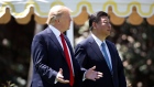 President Donald Trump and Chinese President Xi Jinping walk together at Mar-a-Lago.