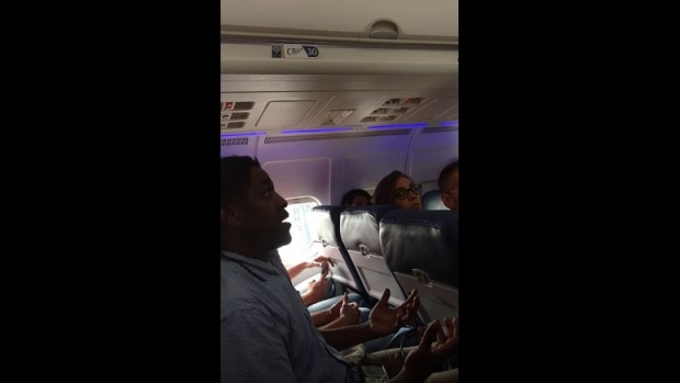 Kima Hamilton in a video of him being asked to leave a Delta flight