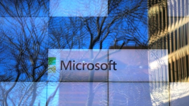 An advertisement is played on a set of large screens at the Microsoft office in Cambridge, Mass.