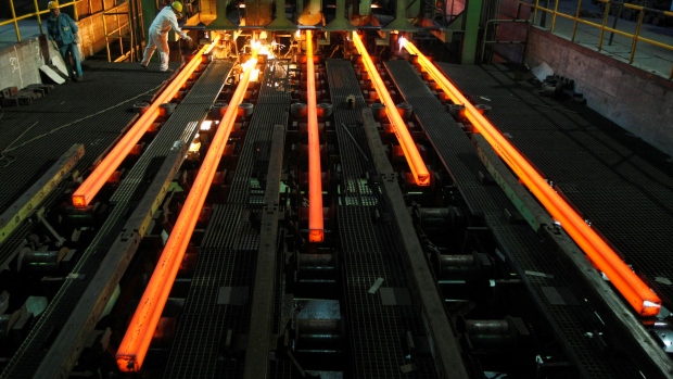 Employees work in a Hangzhou Iron and Steel Group Company workshop in Hangzhou, Zhejiang province. 