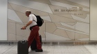 A man arrives at the British Airways check-in desk at Gatwick Airport in southern England, Britain, 