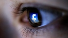 A picture illustration shows a Facebook logo reflected in a person's eye, in Zenica, March 13, 2015