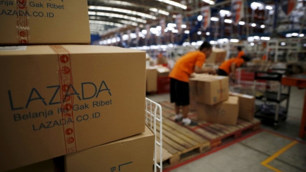 Employees at online retailer Lazada fill orders at the company's warehouse in Jakarta, Indonesia 