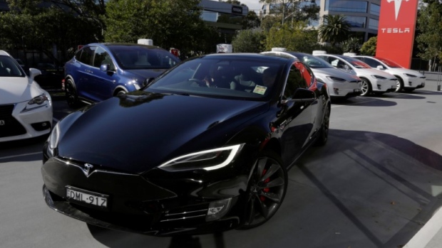A Tesla Model S electric car is taken for a test drive at a Tesla car dealership in Sydney, Australi