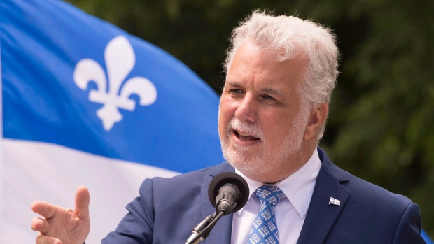 Quebec Premier Philippe Couillard speaks at a ceremony marking the Fete Nationale