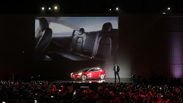 Tesla Chief Executive Elon Musk introduces one of the first Model 3 cars