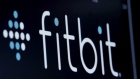 The ticker symbol for Fitbit is displayed at the post where it is traded on the floor of the NYSE