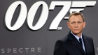 Daniel Craig poses for the media as he arrives for the German premiere of the movie 'Spectre'
