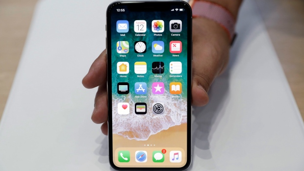 The new iPhone X is displayed in the showroom after the new product announcement