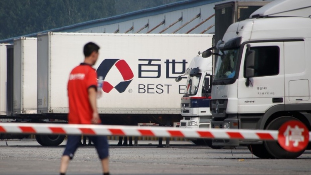 A man walks in the compound of a distribution hub of the Chinese logistics company Best Inc