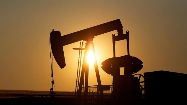 An oil pump jack pumps oil in a field near Calgary, Alberta, Canada July 21, 2014. 