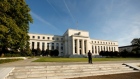 A police officer keeps watch in front of the U.S. Federal Reserve building in Washington, DC