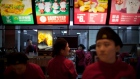 Employees prepare to serve customers at a McDonald's in central Beijing Wednesday, Dec. 15, 2010. 