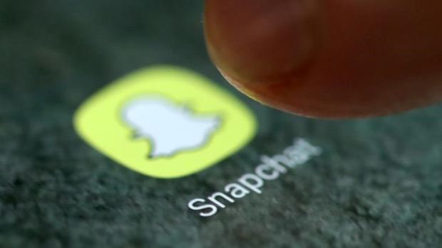 The Snapchat app logo is seen on a smartphone in this picture illustration taken September 15, 2017