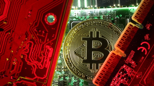 A copy of Bitcoin standing on PC motherboard is seen in this illustration picture, October 26, 2017