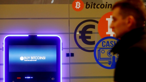 A man walks past a bitcoin ATM in Vilnius, Lithuania December 6, 2017.
