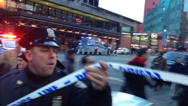 Police respond to a report of an explosion near Times Square on Monday, Dec. 11, 2017, in New York. 