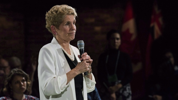 Premier Kathleen Wynne addresses questions from the public during a town hall meeting in Toronto