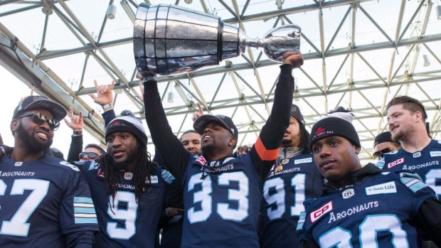 Toronto Argonauts players hold the Grey Cup on Nov 28 2017