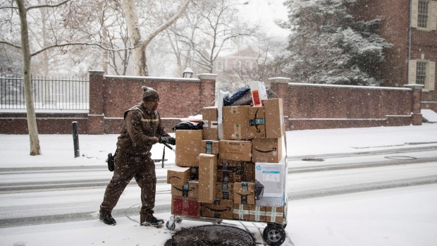 A United Parcel Service worker makes his deliveries during a snowstorm in Philadelphia