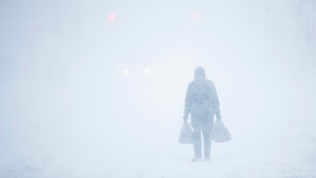 A man makes his way through the snowfall in Atlantic City, N.J., Thursday, Jan. 4, 2018. 
